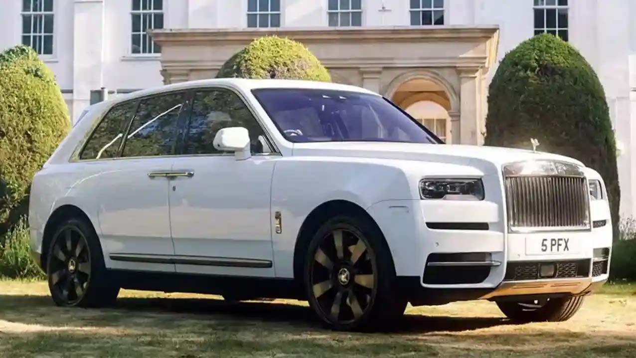 Fromt Side view of Rolls-Royce Cullinan in the garden of a popular wedding venue in Essex